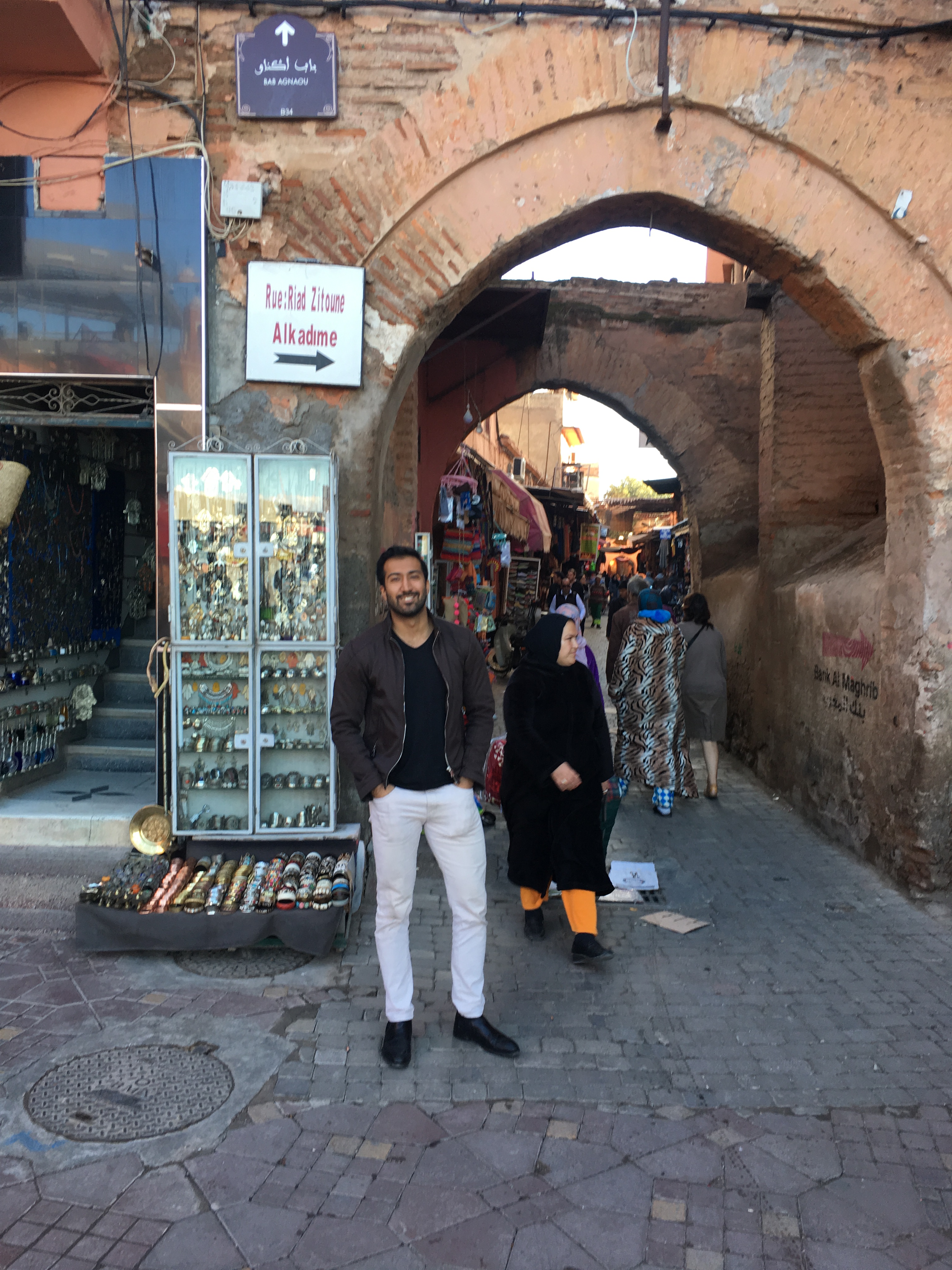 Zach standing next to alley arch.