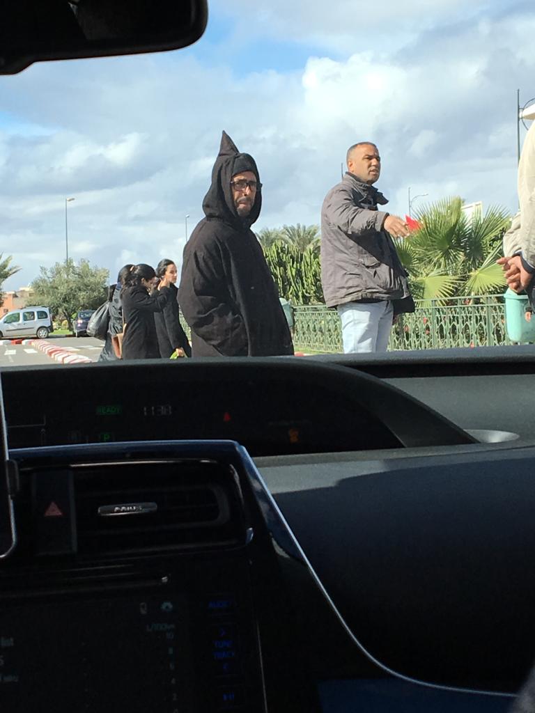 Angry taxi driver in front of our car