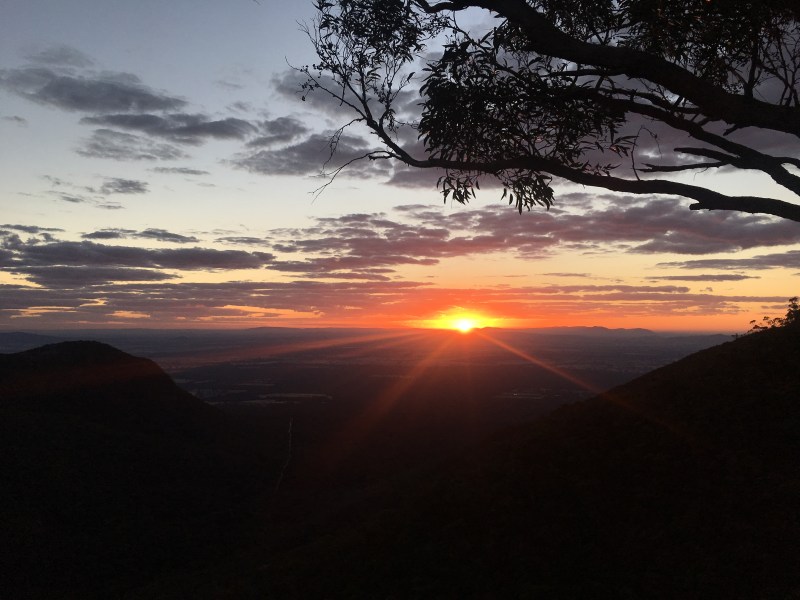 Sunrise as seen from a mountain edge.