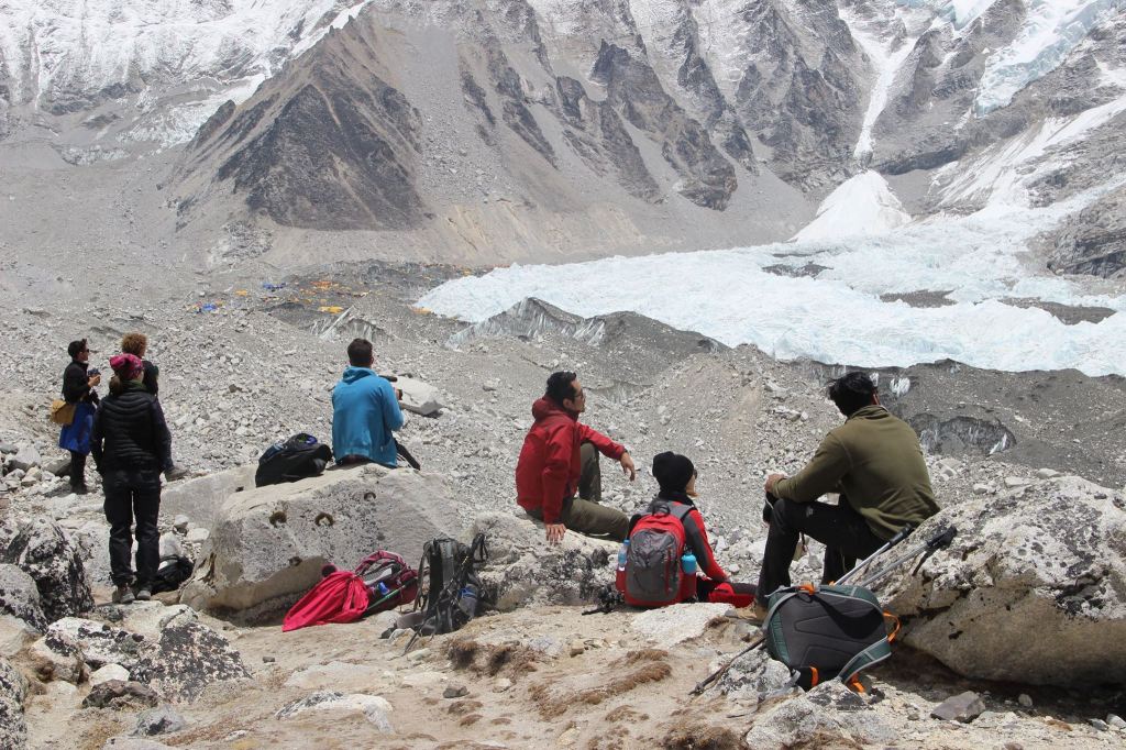 The team taking a break with Everest Base Camp in view