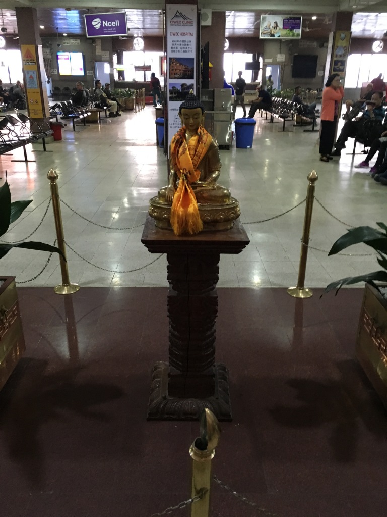 Buddha on pedestal in Lukla airport