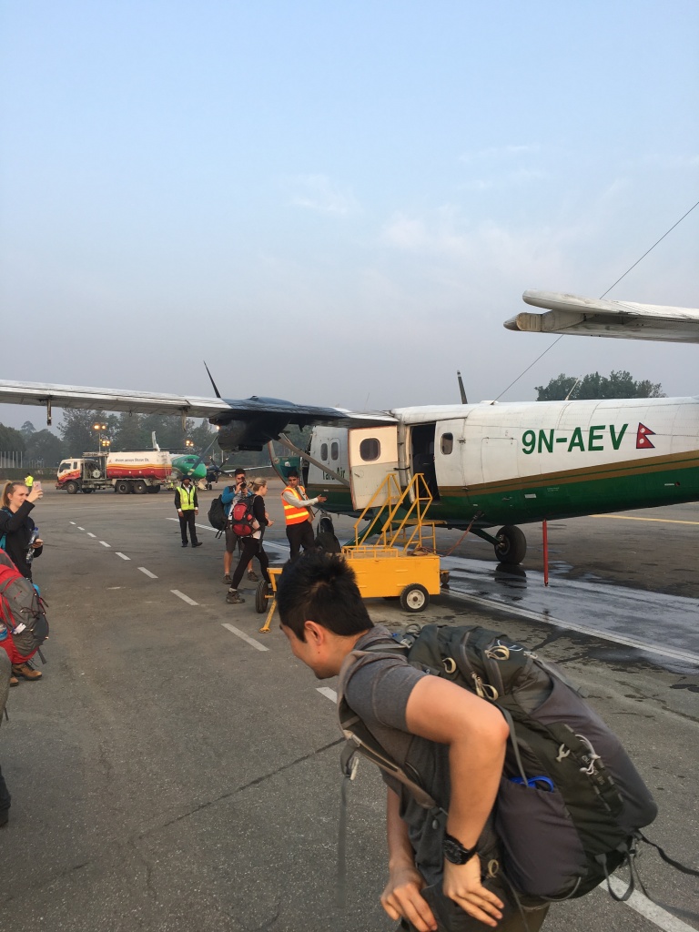Leo heading for twin otter plane in nepal local airport