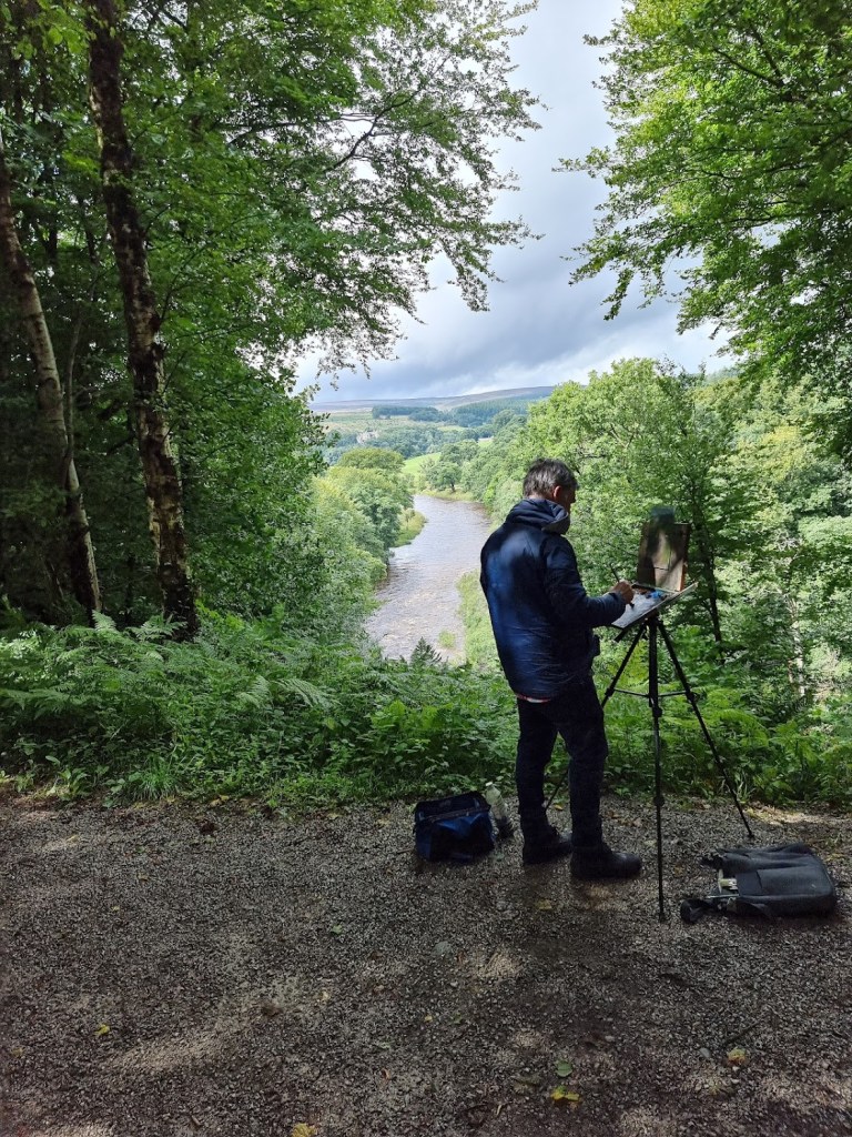 A painter trying turners famous painting 